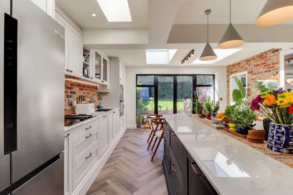 Kitchen island beneath the rooflights at Ashenden, Guildford GU2, a Surrey Build Group project