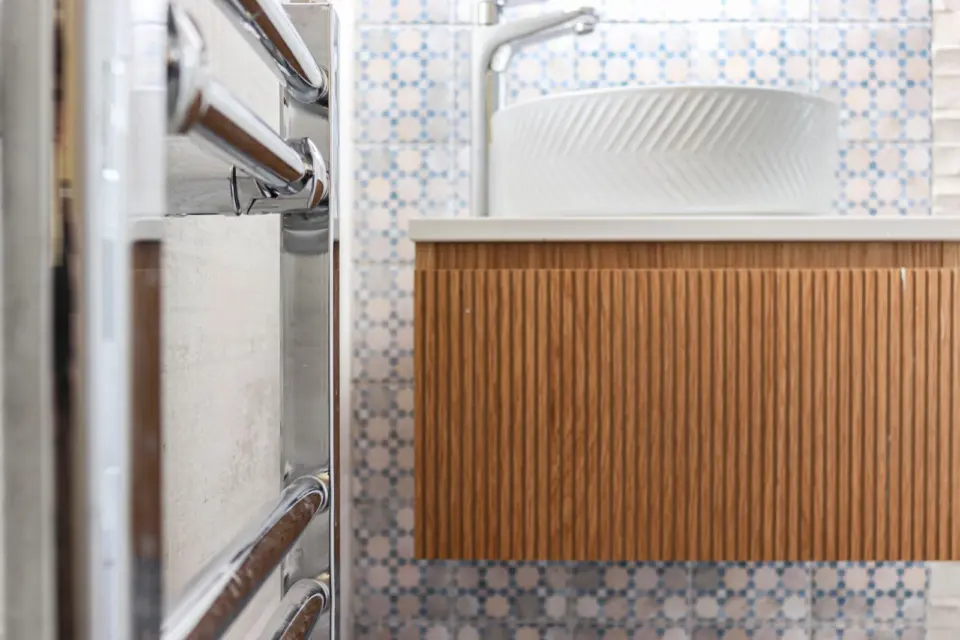 Fluted timber vanity unit at Ashenden, Guildford GU2, a Surrey Build Group project