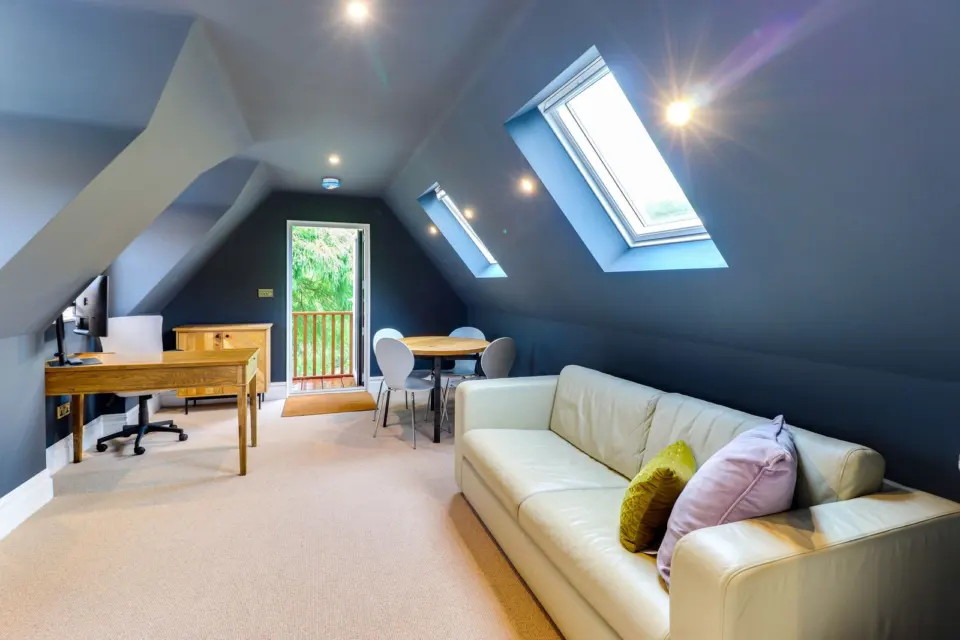 Lounge beneath the roof windows at Mead House, Bramley GU5, a Surrey Build Group project