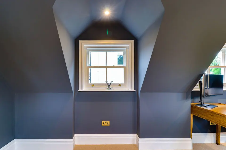 Dormer window and dark walls at Mead House, Bramley GU5, a Surrey Build Group project