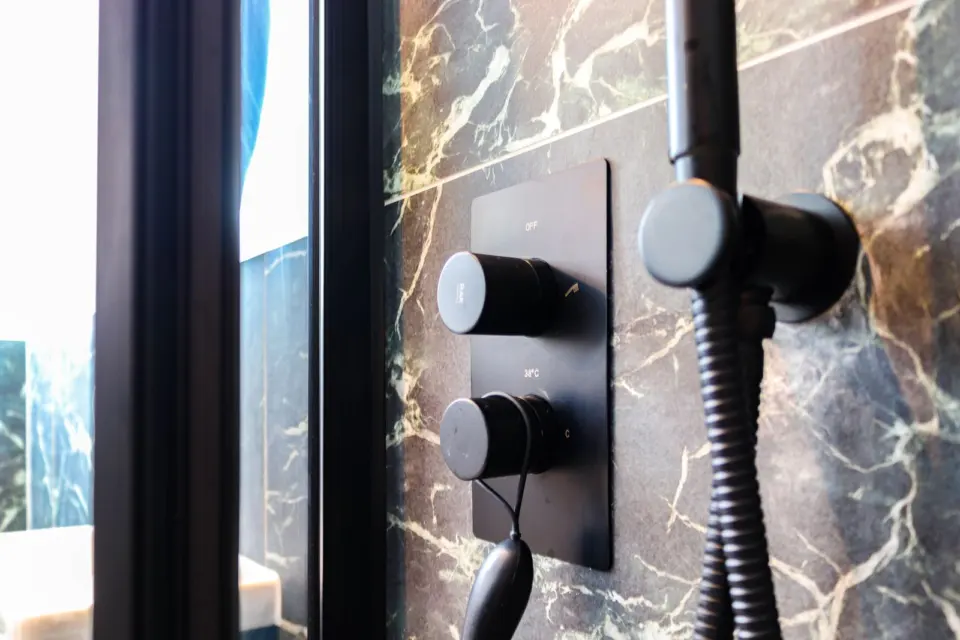 Matt black shower controls at Mead House, Bramley GU5, a Surrey Build Group project