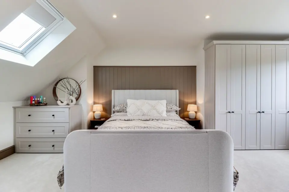 Loft bedroom with fitted wardrobes at Raeburn, Surbiton KT5, a Surrey Build Group project