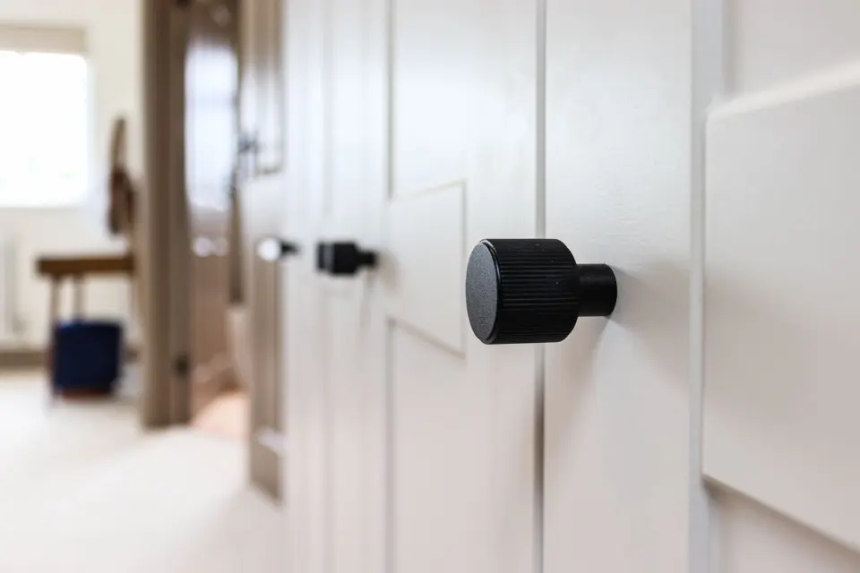 Matt black door furniture at Raeburn, Surbiton KT5, a Surrey Build Group project