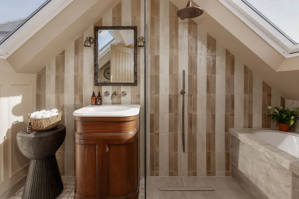 Shower room with striped tiles at The Bakehouse, Shalford GU4, a Surrey Build Group project