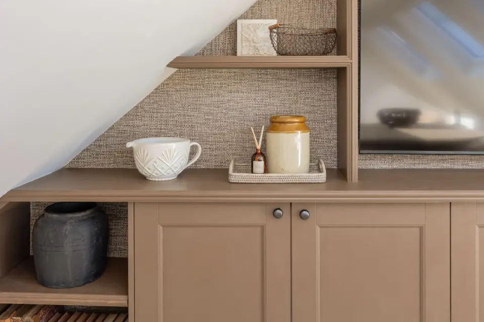 Built in shelving under the eaves at The Bakehouse, Shalford GU4, a Surrey Build Group project