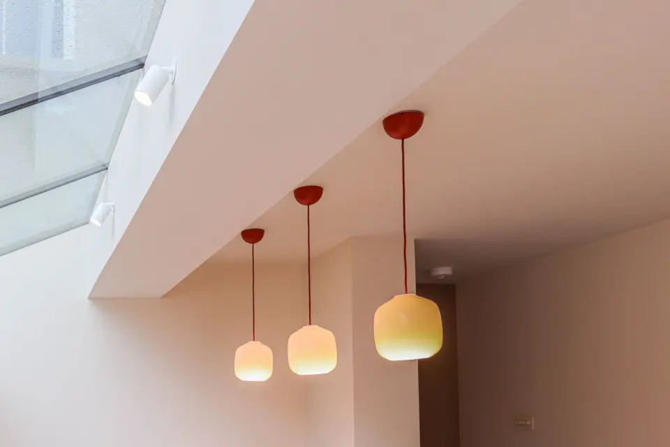 Pendant lights beneath the glazing at The Mount, Guildford GU2, a Surrey Build Group project